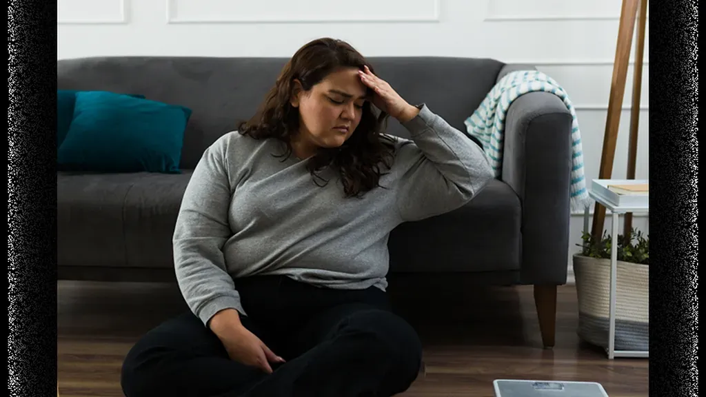 semaglutide-plateau-why-weight-loss-slows-449305 Patient discussing a semaglutide plateau and medical weight loss plan with a provider